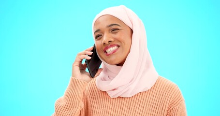 Wall Mural - Phone call, talking and communication with muslim woman in studio for networking, contact and conversation. Connection, technology and chatting with female on blue background for discussion and news