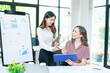 © ND STOCK - business woman using laptop or notebook computer with data analysis graph dashboard, confident woman working with computer laptop concept, contact idea design dashboard graph business conceptual.