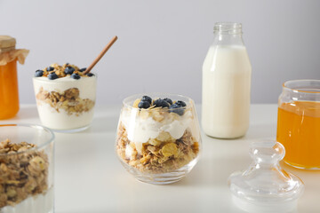 Wall Mural - Tasty and nutritious breakfast concept - muesli with yogurt