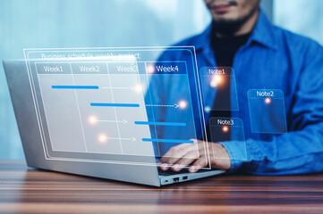 Businessman using computer for project business schedule by weekly, Business plan management concept