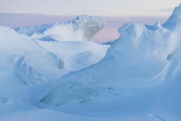Wall Mural - winter arctic landscape. view of snow and ice at sunset. ice hummocks on the frozen sea in the arcti