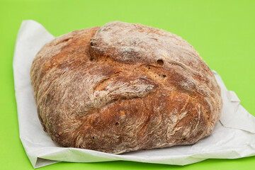 Poster - Fresh bread with cereals on green background