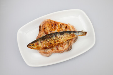 Wall Mural - Grilled sardines with sauce on fresh bread