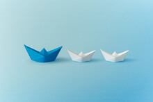 Set Of Colorful Origami Ships On Blue Background