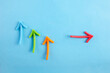 Business disruption and different thinking idea concept Color highlight arrows put around on blue background