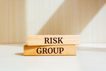 Wall Mural - Wooden blocks with words 'RISK GROUP'.