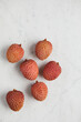 © ADDICTIVE STOCK - Fresh and ripe lychee fruit on smooth surface
