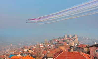 Wall Mural - Air Force aerobatic team performing demonstration flight over Ankara castle - Ankara, Capital city of Turkey 