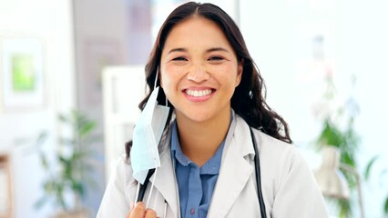 Canvas Print - Doctor, woman and mask off face with smile for success, happiness and stop of covid in hospital. Asian medic, happy and remove ppe in office at clinic for healthcare, wellness and medical service