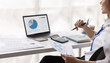 © David - Businesswoman financial expert analyzes business report graph and chart at the office. Concept of financial economy and marketing research.