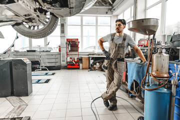 Portrait of a male mechanic in an auto repair shop