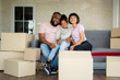 © Prot - Mixed Race families are sitting on the sofa for rest after moving to a new house on the first day after buying real estate.  Concept of starting a new life for a new family.