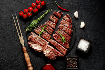 Poster - grilled T-bone steak on stone background