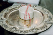 A close-up shot of two golden crosses on reflective plate in an Apostolic church before the christening ceremony