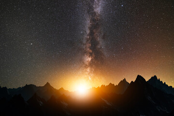 Wall Mural - Fantasy night landscape. Beautiful mountains silhouette in the starry night with milky way galaxy.