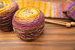 Skeins of self striping yarn on a warm wood background