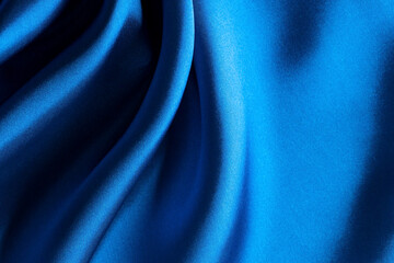 Blue atlas material background, silk abstract drapery cloth