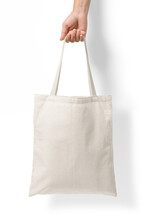 Female Hand Holding A Blank Tote Canvas Bag Mockup Isolated On A Transparent Background, PNG. High Resolution.