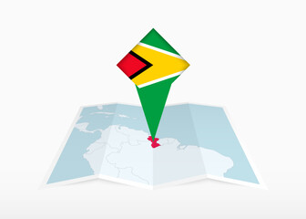 Wall Mural - Guyana is depicted on a folded paper map and pinned location marker with flag of Guyana.