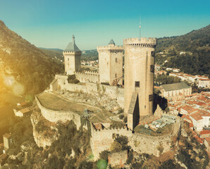 Wall Mural - Picturesque autumn landscape with imposing medieval fortress Chateau de Foix on hill, France