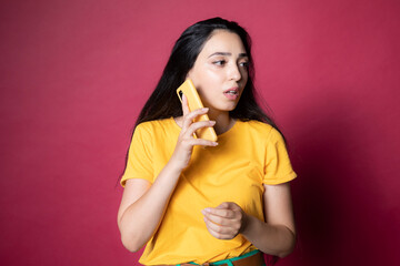 Wall Mural - Beautiful young woman talking on the phone