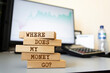 © Uuganbayar - Wooden blocks with words 'Where does my money go?'. Business concept