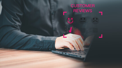 Leinwandbilder - Man hand using a computer laptop with pop up smiley face icon for assessment feedback review satisfaction opinion and testimonial. Customer service experience and business satisfaction survey.