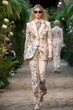 High fashion show in a botanic garden with beautiful young female models in fine casual colorful suits. Generative AI