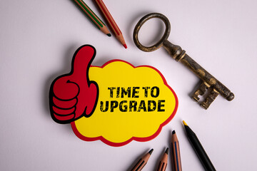 Wall Mural - TIME TO UPGRADE. Notepad, key and colored pencils on white background