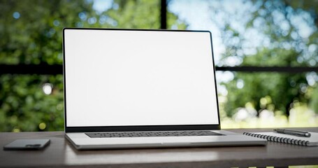 Laptop with blank green screen in office interior. Smooth camera movement around objects with a bokeh background. Home interior or office, 4k 30fps UHD. 3d render