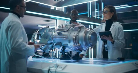 Leinwandbilder - Smart Team of Engineers, Tech Scientist and Machinery Operators Collaborate on a New Type of a Electric Turbine Engine, Using Computers and Measuring Tools in Scientific Technology Lab