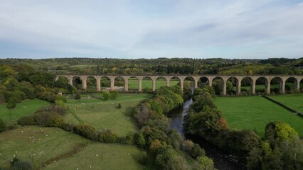 Wall Mural - Beautiful drone view of a Hewenden Viaduct surrounded by green nature