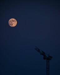 beautiful view of full moon on a blue sky background
