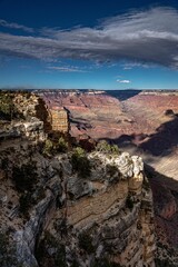 Canvas Print - Mountain range in Colorado, with cliffs covered by vegetation, with clouds' shadows over the valley