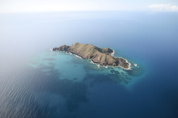 Wall Mural - aerial view of a small island in the middle of the ocean. created with generative ai technology
