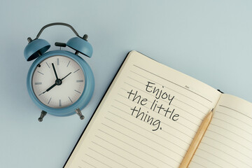 Wall Mural - Inspirational quote - Enjoy the little thing text on note pad with alarm clock