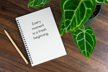 Wall Mural - Short inspirational quotes text on note pad - Every moment is a fresh beginning