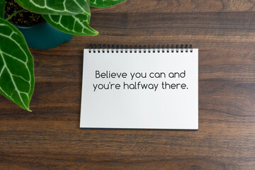 Wall Mural - Short inspirational quotes text on note pad - Believe you can and you're halfway there.