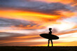 © Travel 'n' Lifestyle - View of a girl silhouette standing on the rocks near ocean with epic sunset sky in the background, Baja California Sur, Mexico.