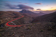 © robertharding - View of road trail lights and mountains from Astronomical viewpoint Sicasumbre at dusk, Pajara, Fuerteventura