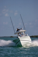 Wall Mural - Center console fishing boat approaching at speed and turning.