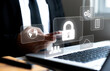 © Isara - concept of cyber security, data security and encryption, secure access to user personal data, secure internet access, cyber security Businessman touching an icon key through the virtual screen