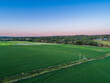 © Austockphoto - Aerial view of pastel dusk sky above lush green lucerne crop paddock