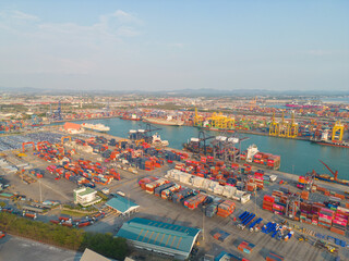 Wall Mural - Aerial view of container cargo ship in the export and import business and logistics international goods in urban city. Shipping to the harbour by crane in Bangkok harbour, Thailand.