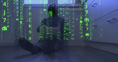 Matrix video effect, binary code instead of face of hooded programmer sitting on floor with laptop. Abstract, screen-filling green symbols. Concept of cyber security, end of system hacking, internet