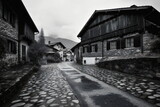 Fototapeta  - Schweizer Bergdorf bei Regen in schwarz-weiss aufgenommen.
