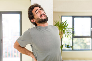 Wall Mural - young adult crazy man with expressive pose at a modern house interior