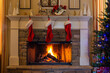 © Carol A Hudson - Three red and white Christmas stockings hung by the stone fireplace to decorate for the holidays.