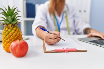 Sticker - Young redhead man wearing dietician uniform working at clinic