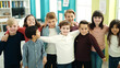 © Krakenimages.com - Group of kids students smiling confident hugging each other at classroom